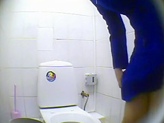 Peeping pissing women in the public toilet