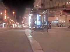 Pretty woman in a dress pisses in public