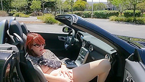 Redhead MILF fucking herself in public parking lot and trails
