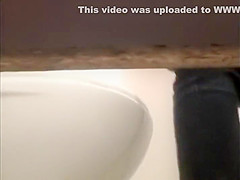 Secretly watching a college girl pee