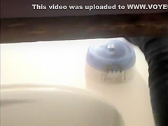 Secretly watching a college girl pee