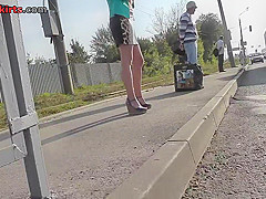 Sexy blonde gal shows off g-string in candid upskirts