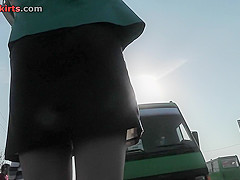 Sexy blonde gal shows off g-string in candid upskirts