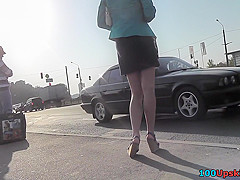 Sexy blonde gal shows off g-string in candid upskirts