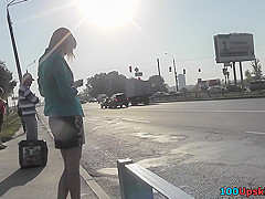 Sexy blonde gal shows off g-string in candid upskirts