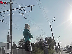 Sexy blonde gal shows off g-string in candid upskirts