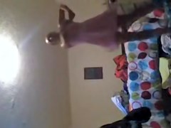 Solo girl making the bed and getting dressed