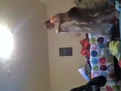 Solo girl making the bed and getting dressed