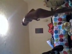 Solo girl making the bed and getting dressed