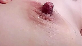 Spitting on my massive nipples and then sucking them (closeup)