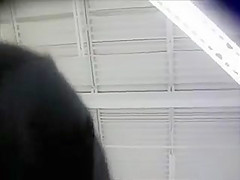 Spying up a milf skirt on a shopping trip