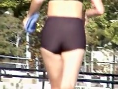 Tiny tight shorts and top on the candid running babe 01d