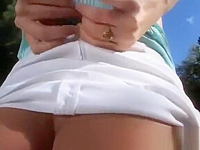 Touching her round natural tits outdoors