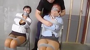 Two damsels tape bondage