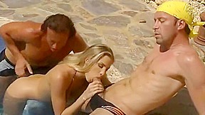 Two dudes crack open a Russian doll by the pool