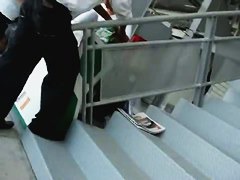 Up the stairs and up the skirt for a video of blue panties