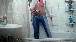 Wetlook pissing and showering jeans
