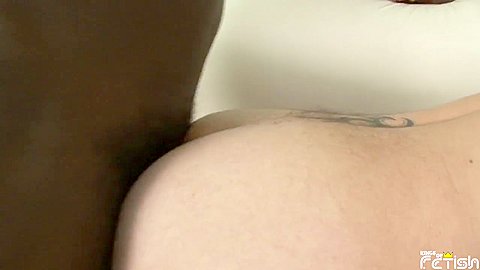 White guy gets his ass pumped by a tall black man on the couch