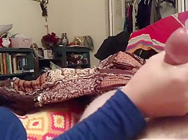 Wife giving hand job while reading 