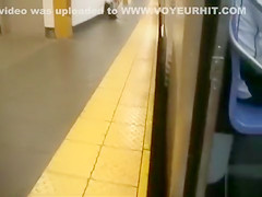 coed relieves herself at a metro station