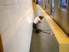 coed relieves herself at a metro station