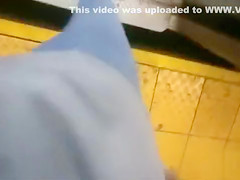 coed relieves herself at a metro station