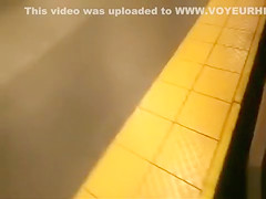 coed relieves herself at a metro station