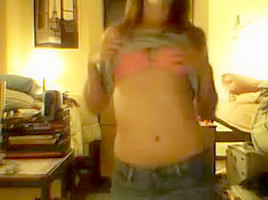 immature girl strips in front of a webcam
