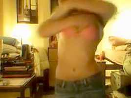 immature girl strips in front of a webcam