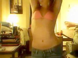 immature girl strips in front of a webcam