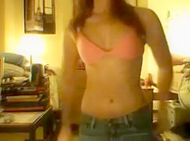 immature girl strips in front of a webcam