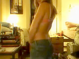 immature girl strips in front of a webcam