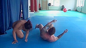 strong brunette dominates guy in wrestling