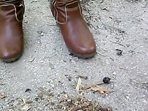 woman crush bugs boots