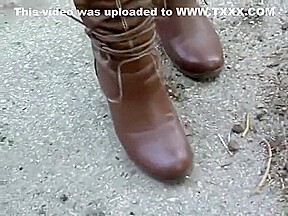 woman crush bugs boots
