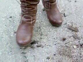 woman crush bugs boots